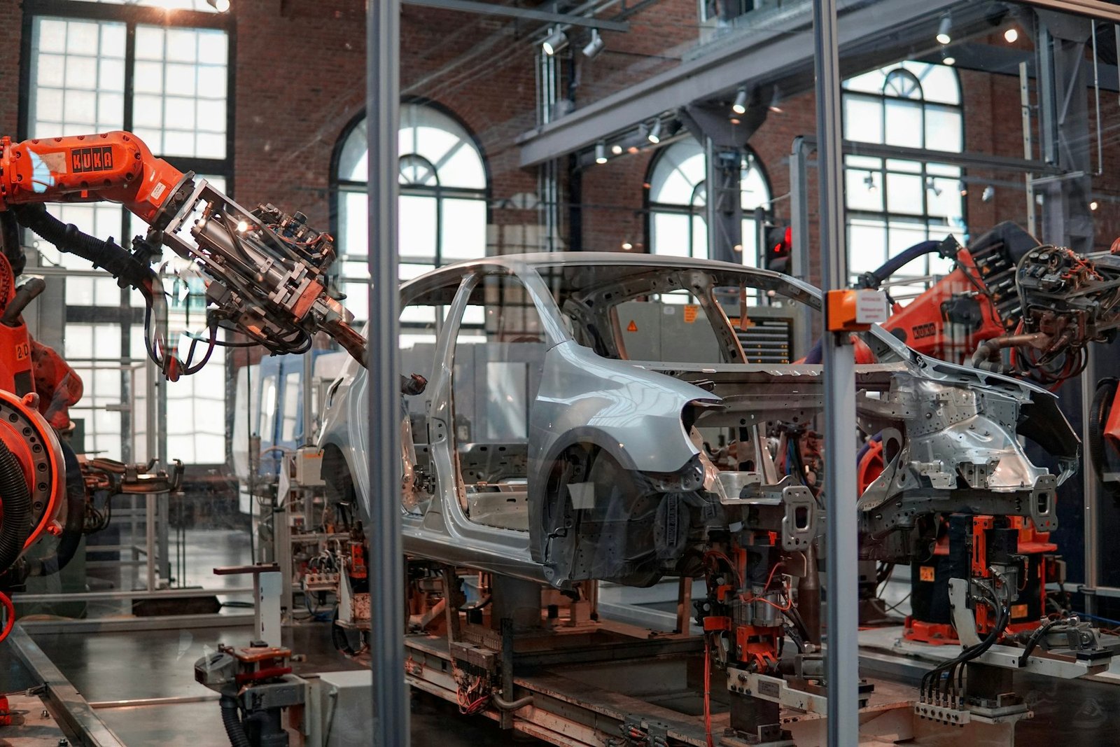 Robotic arms on an automotive body assembly line